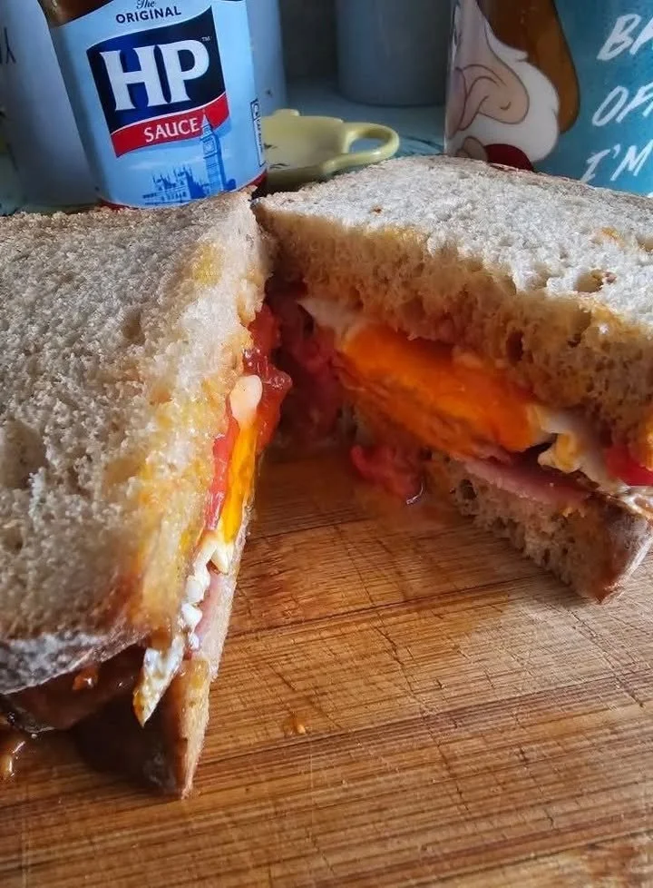 Bacon Egg Tomato Sandwich with crispy bacon, fresh tomatoes, and fried egg on bread