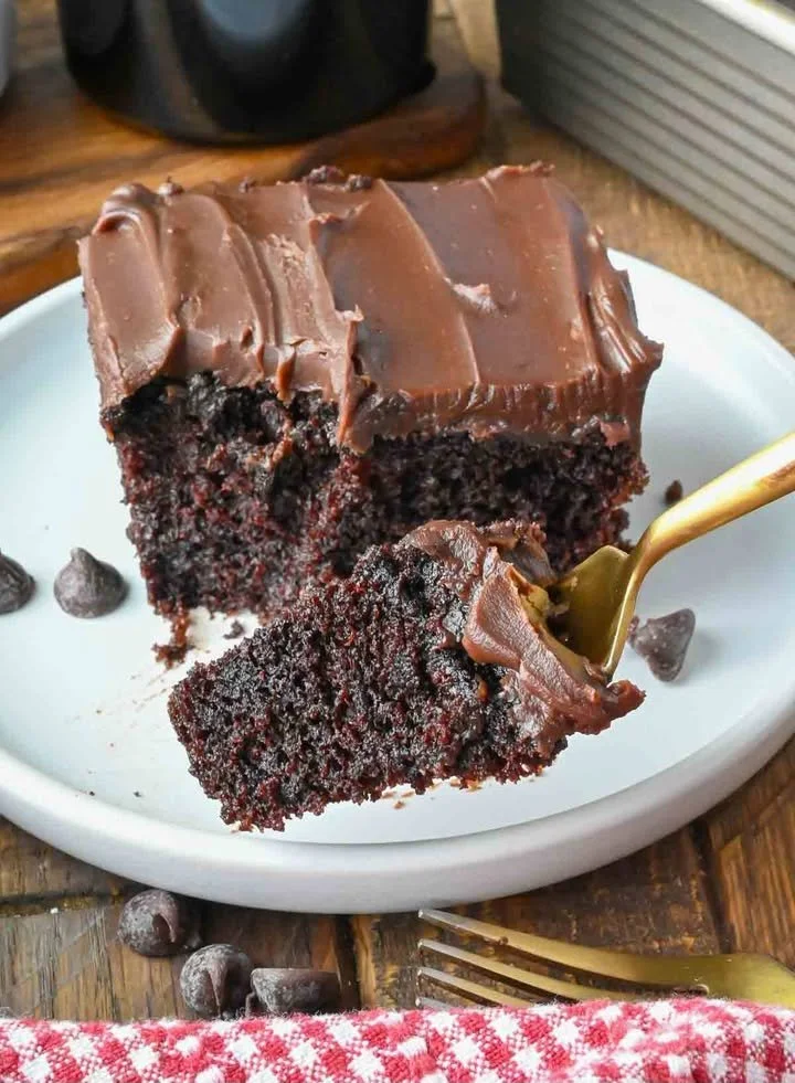Delicious Bailey's chocolate cake topped with creamy frosting and chocolate shavings.