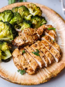 Baked Balsamic Chicken Breast with herbs and vegetables on a plate