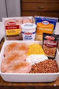 Baked Chicken Casserole topped with melted cheese and crispy bacon.