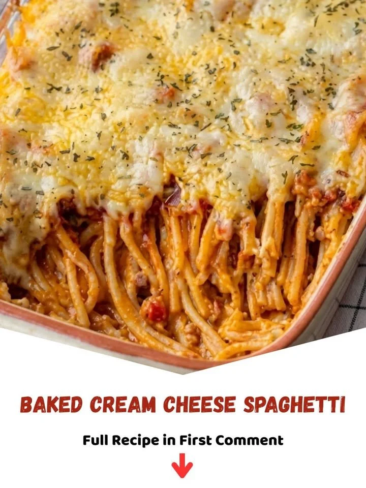 Baked cream cheese spaghetti topped with melted cheese and herbs