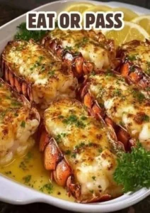 Delicious baked lobster tails topped with garlic butter and herbs