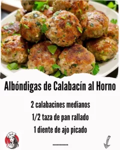 Delicious baked zucchini meatballs served on a plate with a side of marinara sauce.