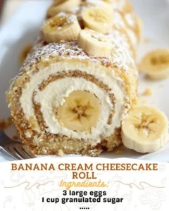 Delicious Banana Cream Cheesecake Roll topped with banana slices and whipped cream