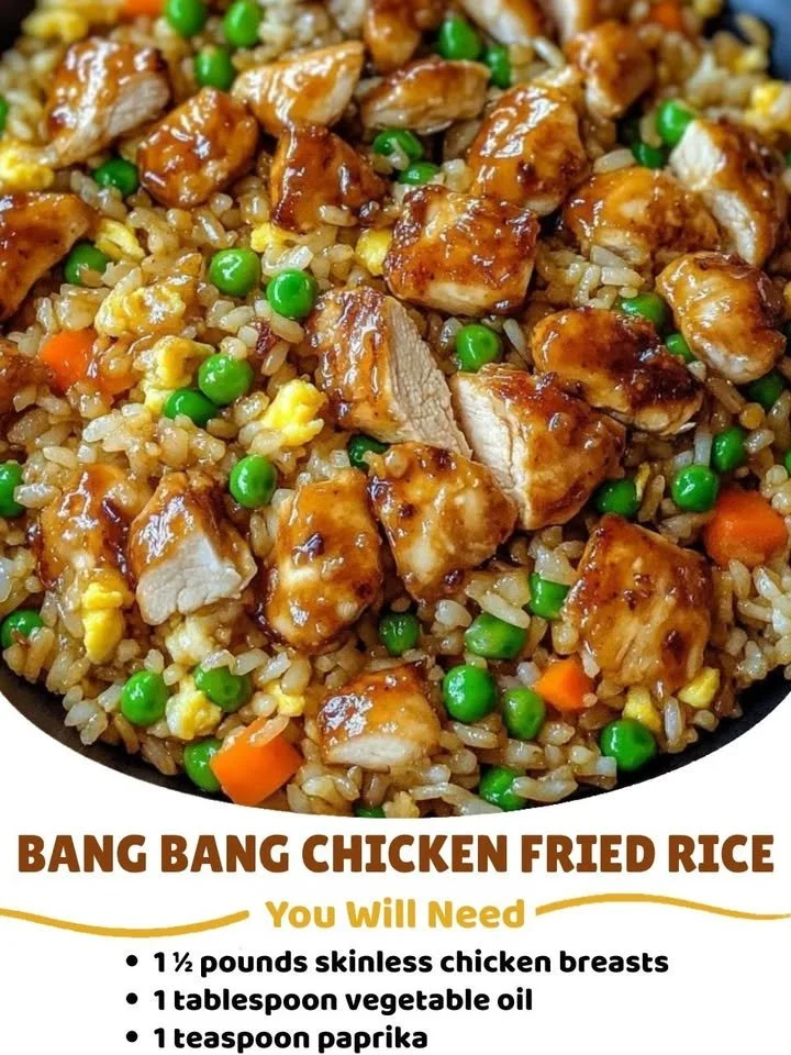 Plate of Bang Bang Chicken Fried Rice garnished with green onions and sesame seeds