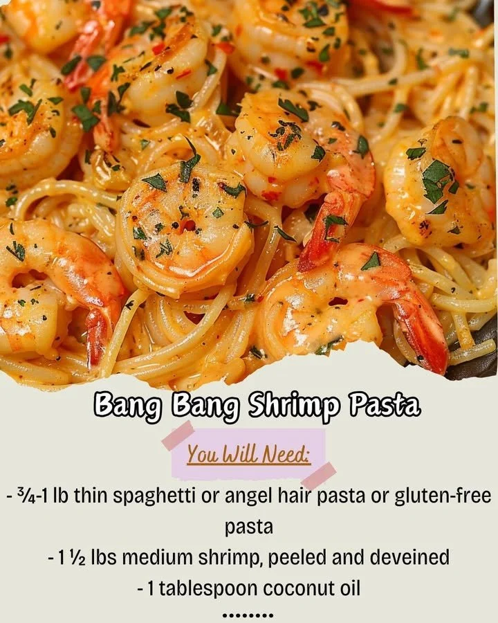 Plate of Bang Bang Shrimp Pasta garnished with green onions and herbs