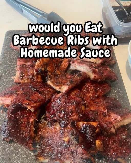 Juicy barbecue ribs with homemade sauce on a grill