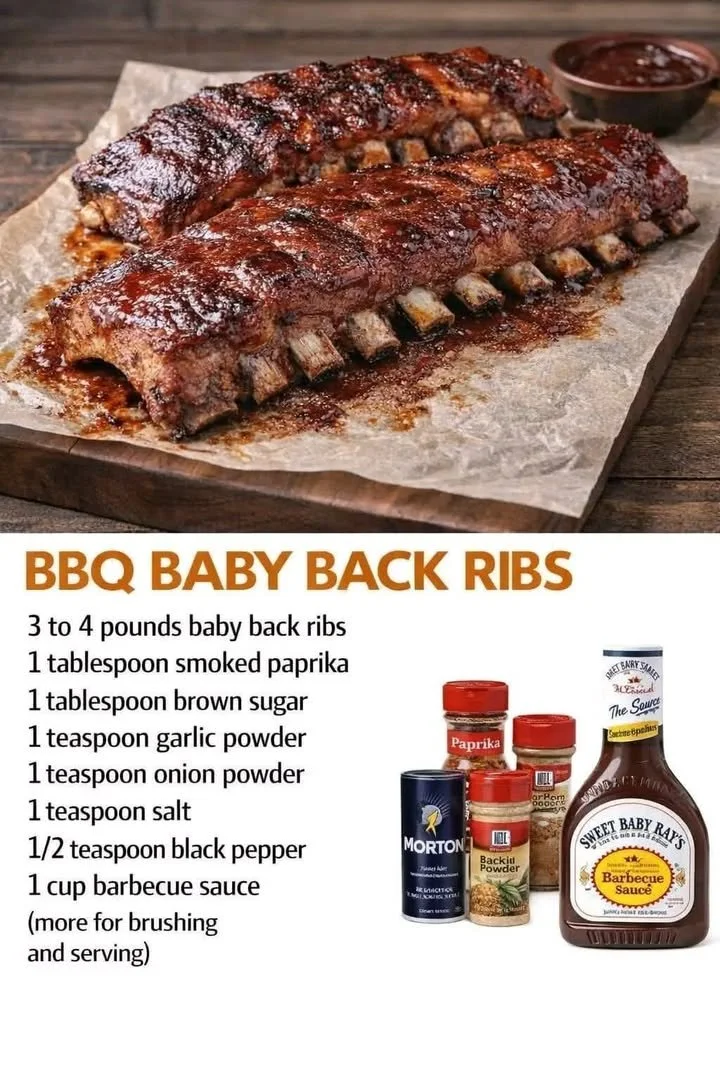 Delicious BBQ Baby Back Ribs served on a platter with sauce and garnishes.