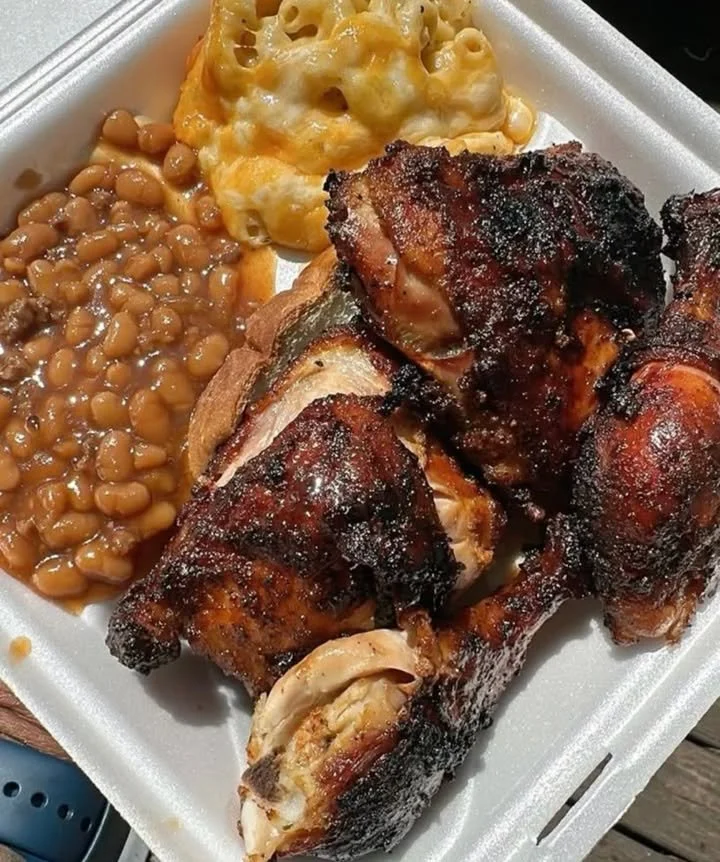 Grilled BBQ chicken with smoky glaze on a BBQ grill