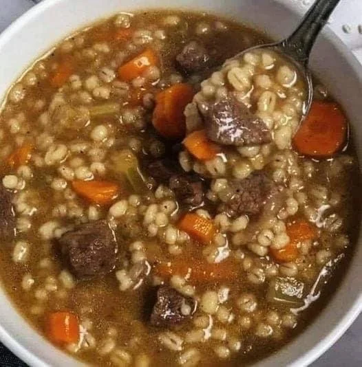 Delicious Beef Barley Soup cooked in a Crock Pot for a comforting meal.
