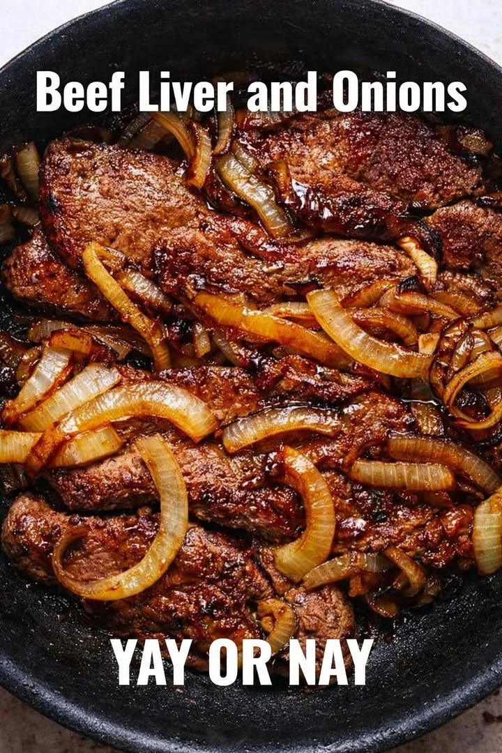 Delicious plate of beef liver and onions garnished with fresh herbs