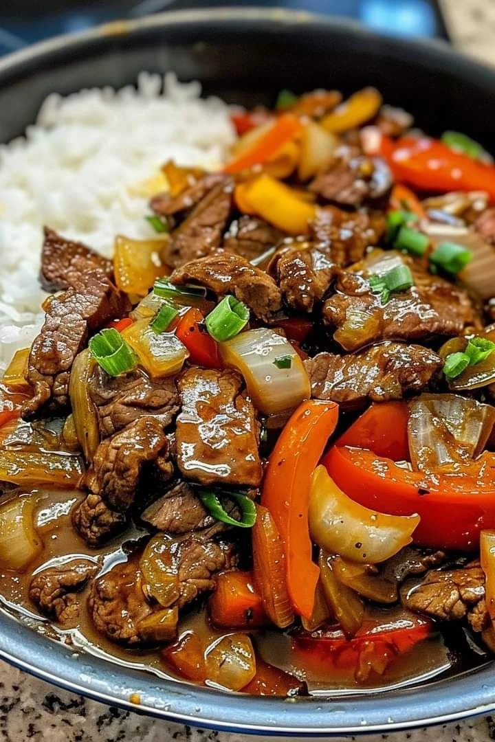 Colorful beef stir-fry with vegetables in a skillet