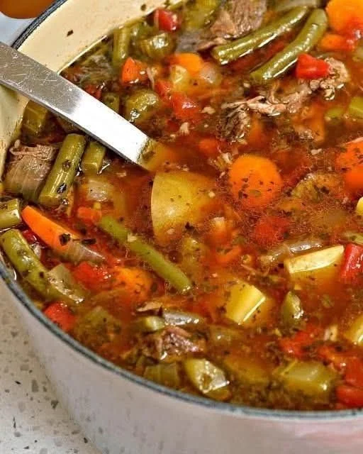 Bowl of hearty Beef Vegetable Soup with colorful vegetables and tender meat