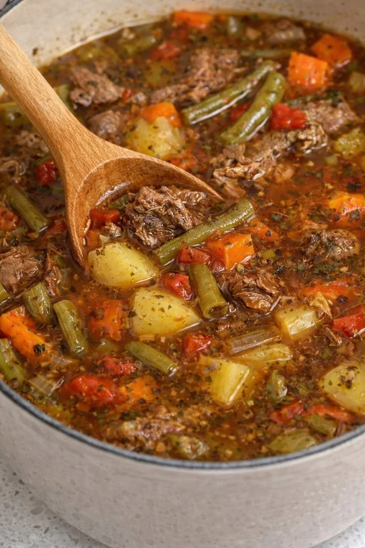 Bowl of homemade beef vegetable soup with fresh vegetables and tender beef chunks