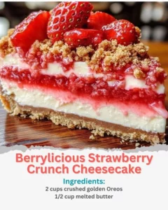 Slice of Berrylicious Strawberry Crunch Cheesecake topped with fresh strawberries