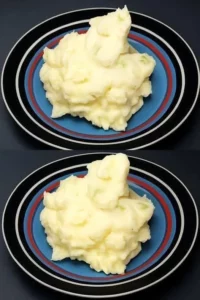 Delicious bowl of creamy mashed potatoes with butter and herbs.