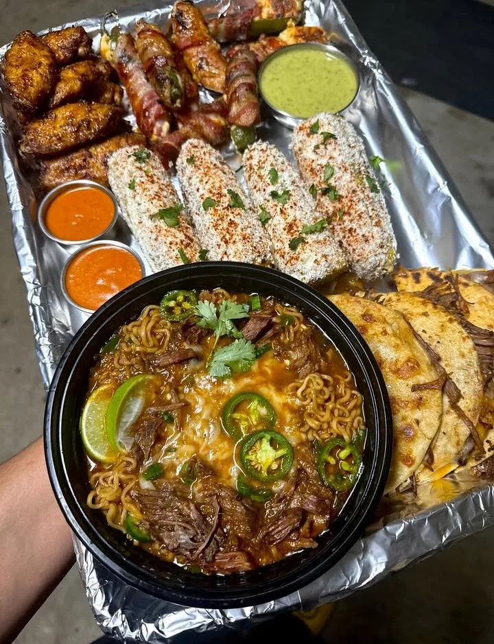 Delicious Birria Platter served with traditional sides and flavorful consommé.