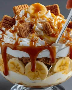 Delicious Biscoff banana pudding with caramel layered in a dessert dish.