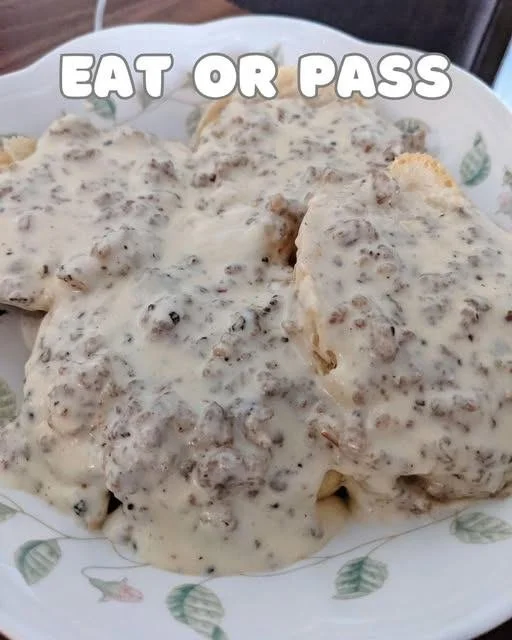 Delicious biscuits and gravy served on a plate, perfect for breakfast.