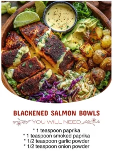 Blackened salmon bowl with fresh vegetables and grains
