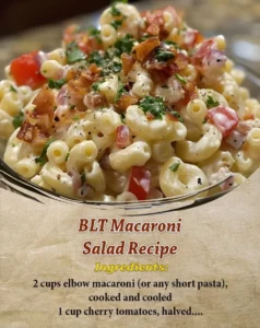 A fresh bowl of BLT Macaroni Salad with bacon, lettuce, and tomatoes.