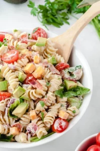 A delicious bowl of BLT Pasta Salad with bacon, lettuce, and tomatoes.