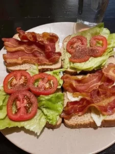 Classic BLT sandwich with crispy bacon, lettuce, and tomatoes on a plate