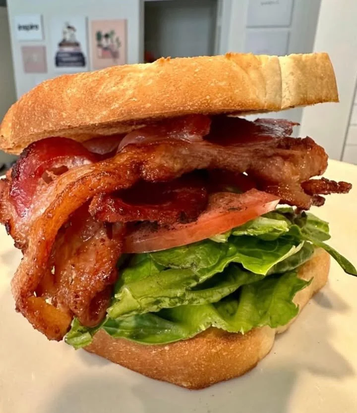 Delicious BLT sandwich with bacon, lettuce, and tomato on toasted bread.
