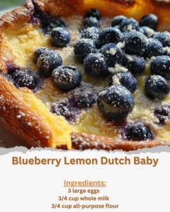 Fluffy Blueberry Lemon Dutch Baby topped with fresh blueberries and lemon zest