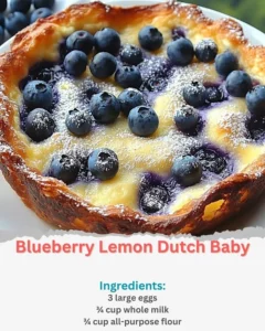 Fluffy Blueberry Lemon Dutch Baby served with fresh berries and lemon zest