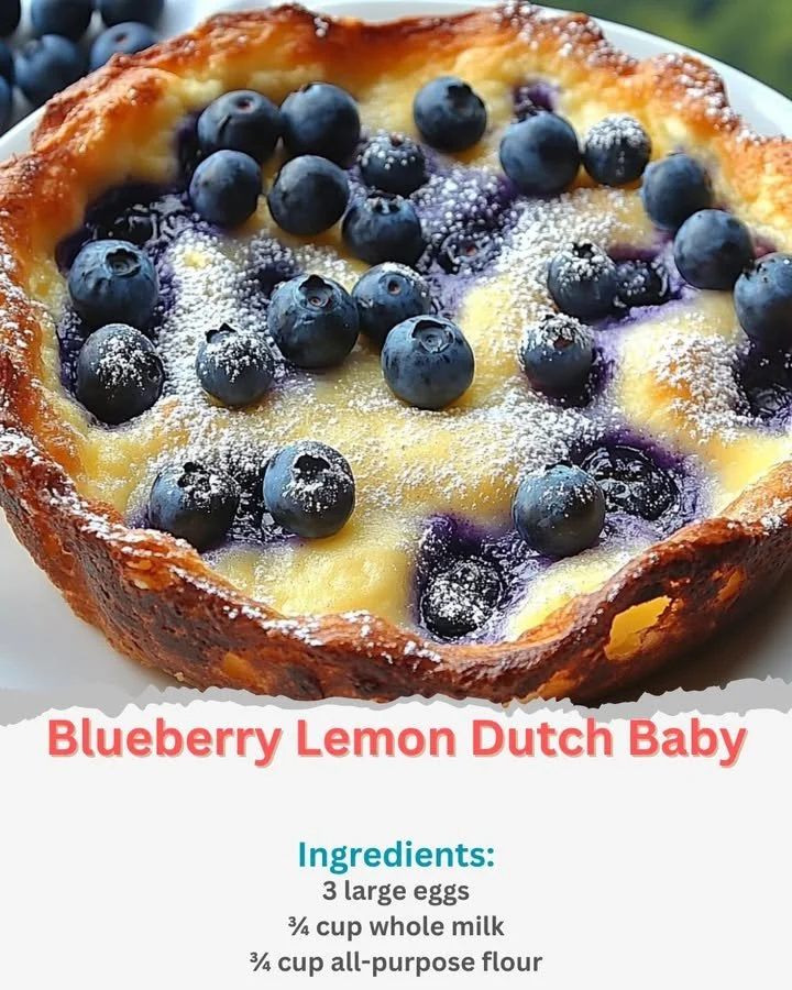 Fluffy Blueberry Lemon Dutch Baby served with fresh berries and lemon zest