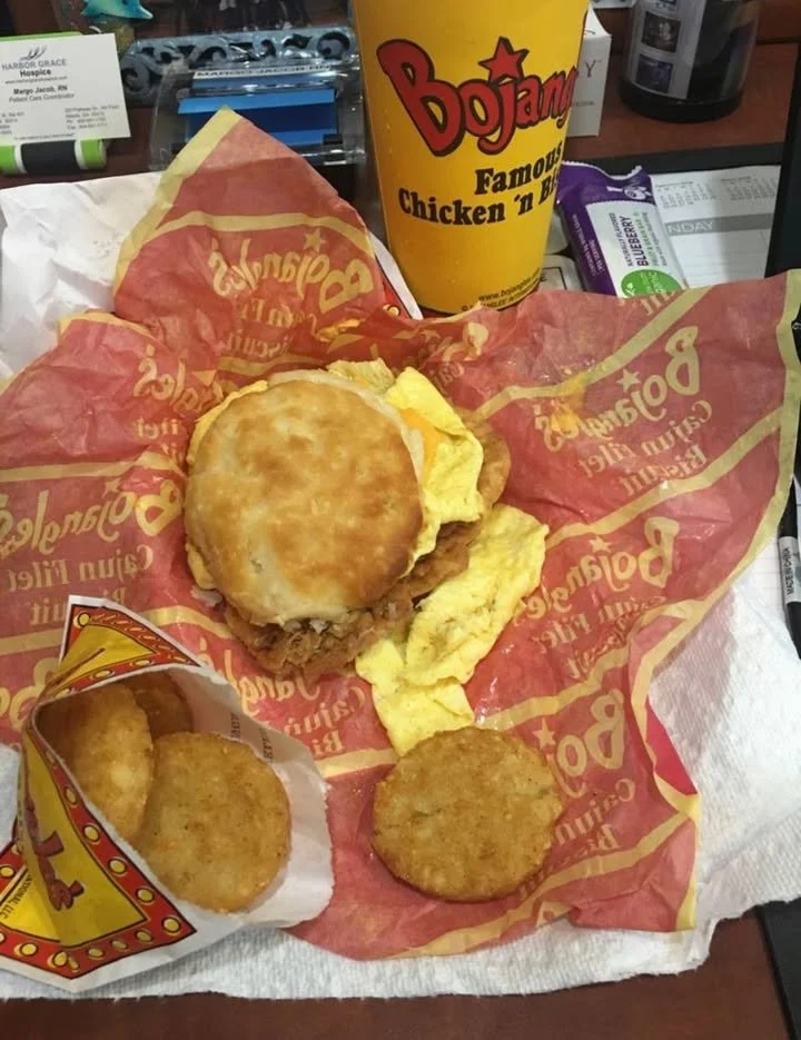 Delicious Bojangles breakfast spread with biscuits, chicken, and coffee