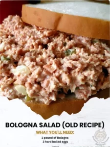 Bowl of colorful Bologna Salad garnished with fresh herbs and vegetables