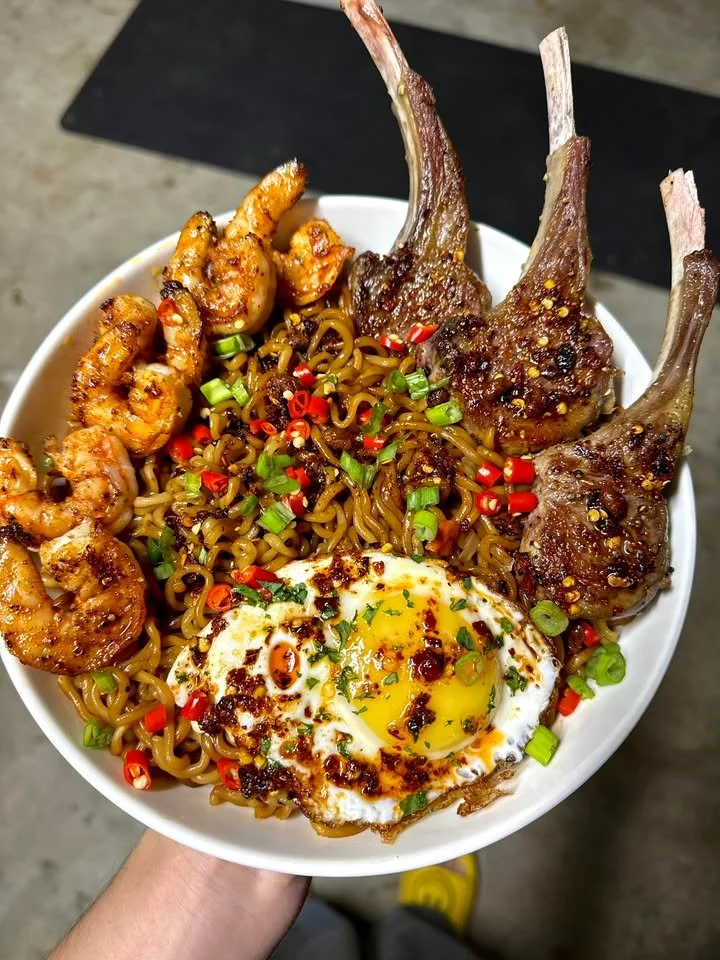 Boujee shrimp ramen with lamb chops served in a bowl for a gourmet experience
