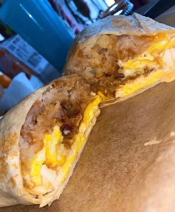 Delicious breakfast burritos with fresh ingredients on a plate