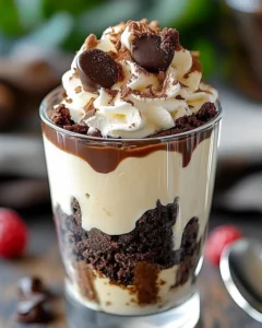 Delicious Brownie Cheesecake Parfait layered with rich brownie and creamy cheesecake