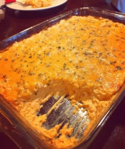 Delicious Buffalo Chicken Dip served in a bowl with tortilla chips on the side.