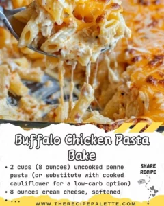Baked Buffalo Chicken Pasta with cheese and spices in a serving dish