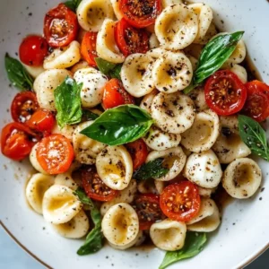 Delicious Burrata & Basil Snail Pasta Salad served in a bowl