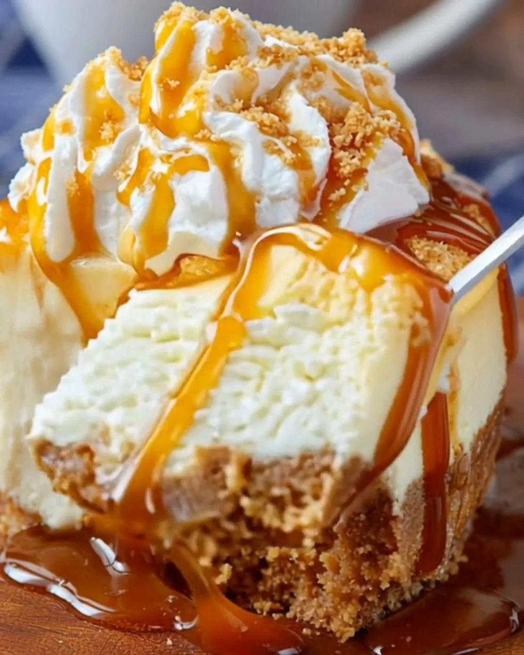 A delicious slice of Butterbeer Cheesecake topped with caramel drizzle.