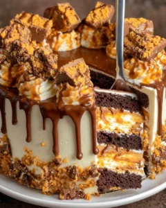 Decadent Butterfinger Bomb Cake with chocolate and caramel layers