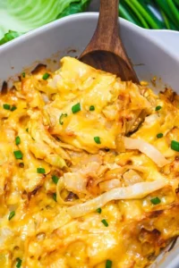 Baked Cabbage Casserole topped with cheese and herbs, a delicious comfort food dish