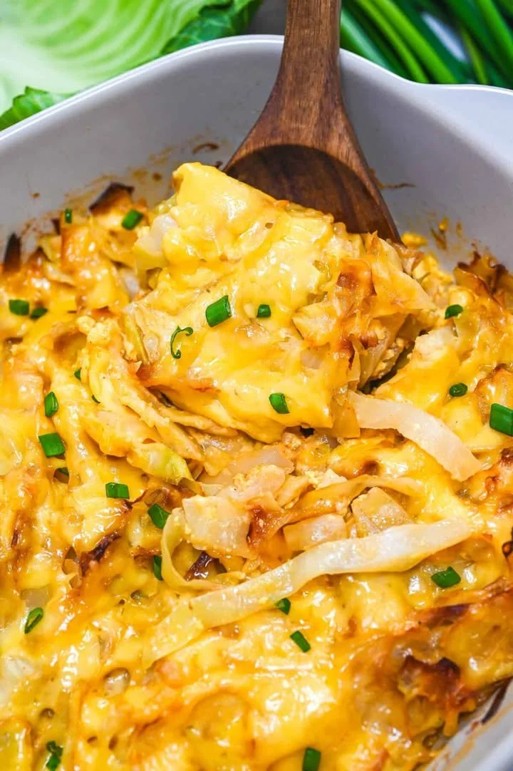Baked Cabbage Casserole topped with cheese and herbs, a delicious comfort food dish