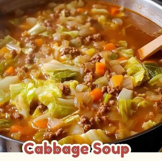 Bowl of healthy and delicious cabbage soup garnished with fresh herbs