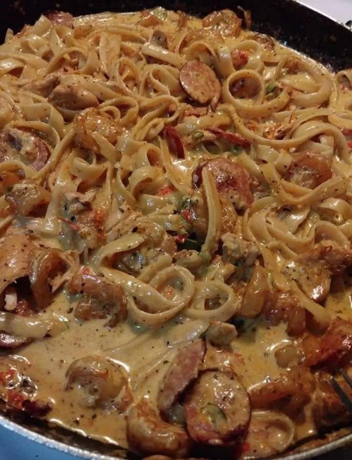 Delicious Cajun Alfredo Pasta garnished with herbs and spices