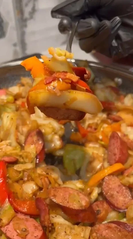Delicious Cajun Cabbage Jambalaya served in a bowl with fresh herbs.