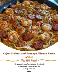 Cajun Shrimp and Sausage Alfredo Pasta dish served with fresh herbs and cheese.