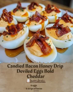 Candied Bacon Honey Drip Deviled Eggs topped with crispy bacon on a serving platter
