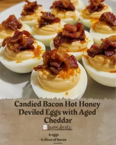 Candied Bacon Hot Honey Deviled Eggs topped with Aged Cheddar