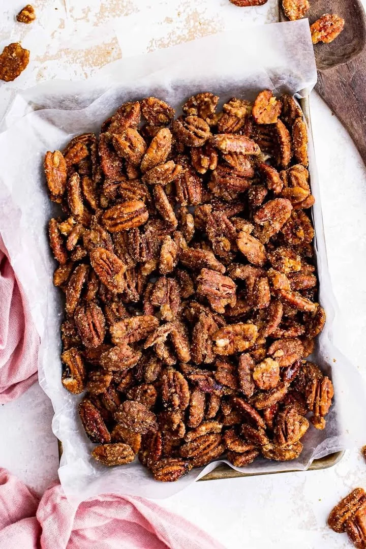 Bowl of sweet and crunchy candied pecans for snacking or desserts